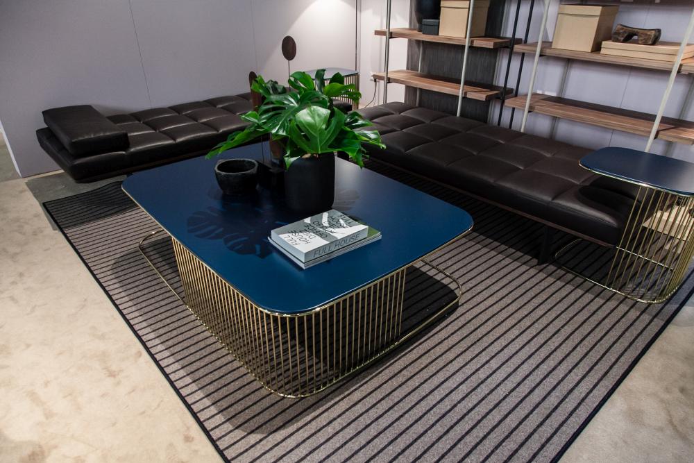 The matching tables combined with the leather padded benches give this area a chic and modern look