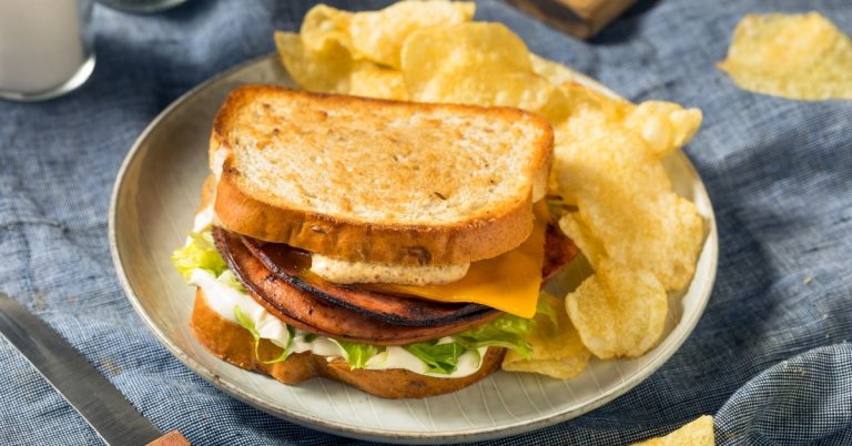 Delicious_Homemade_Bologna_Sandwich_with_Lettuce_Cheese_and_Chips.jpg