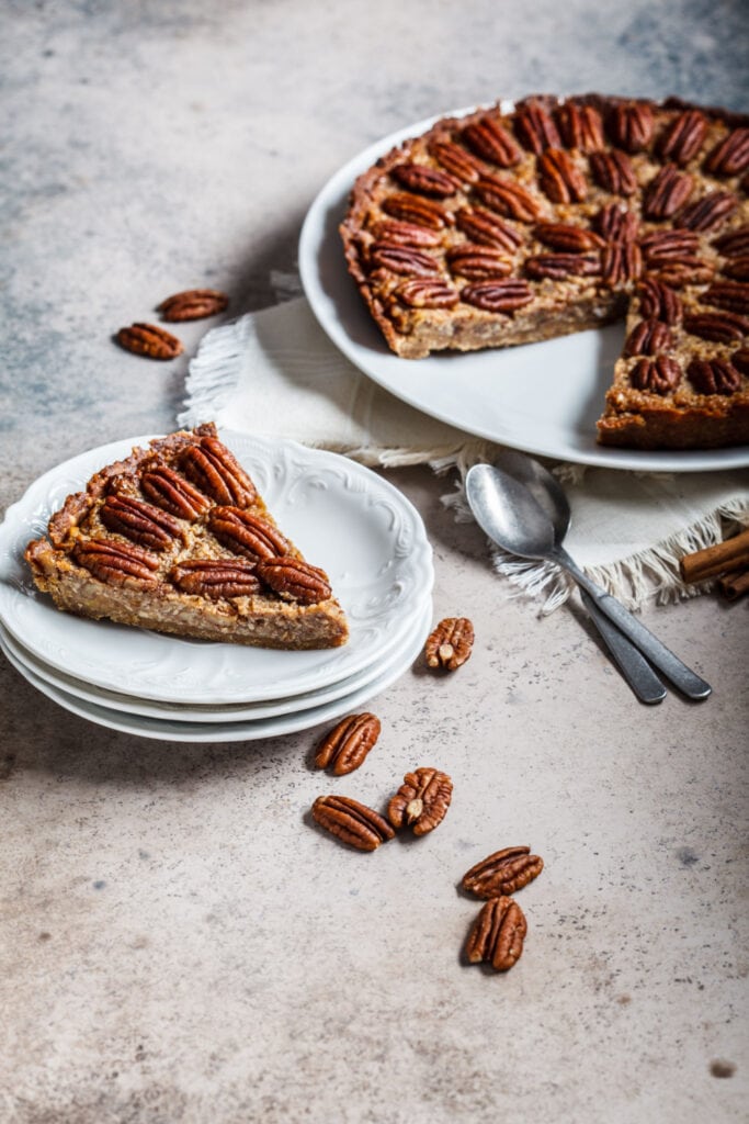 A Slice of Pecan Pie on a Gray Surface
