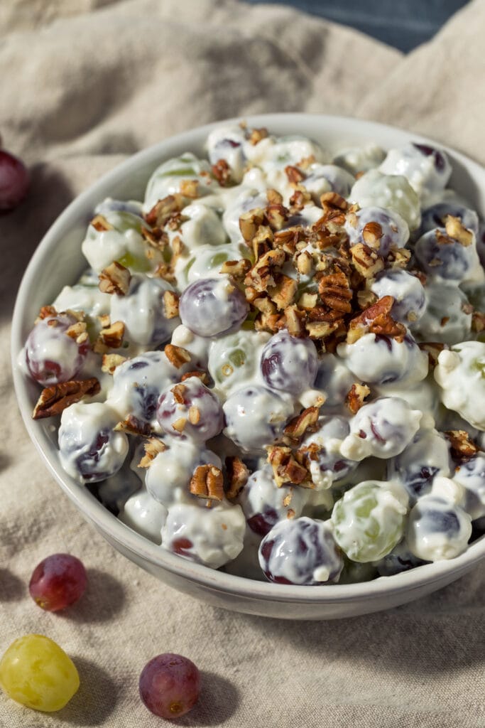 Creamy Grape Salad in a Bowl with Chopped Pecans