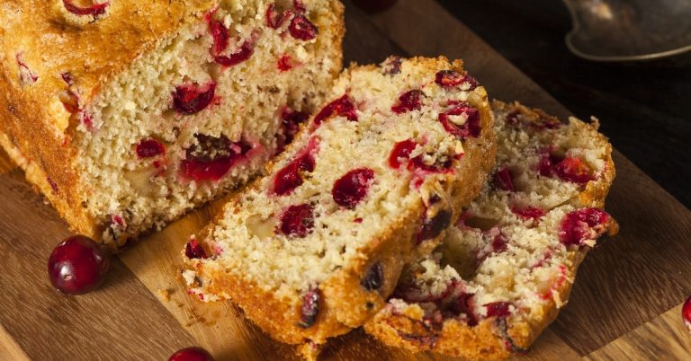 Homemade-Soft-and-Fluffy-Cranberry-Orange-Bread-in-a-Wooden-Cutting-Board.jpg