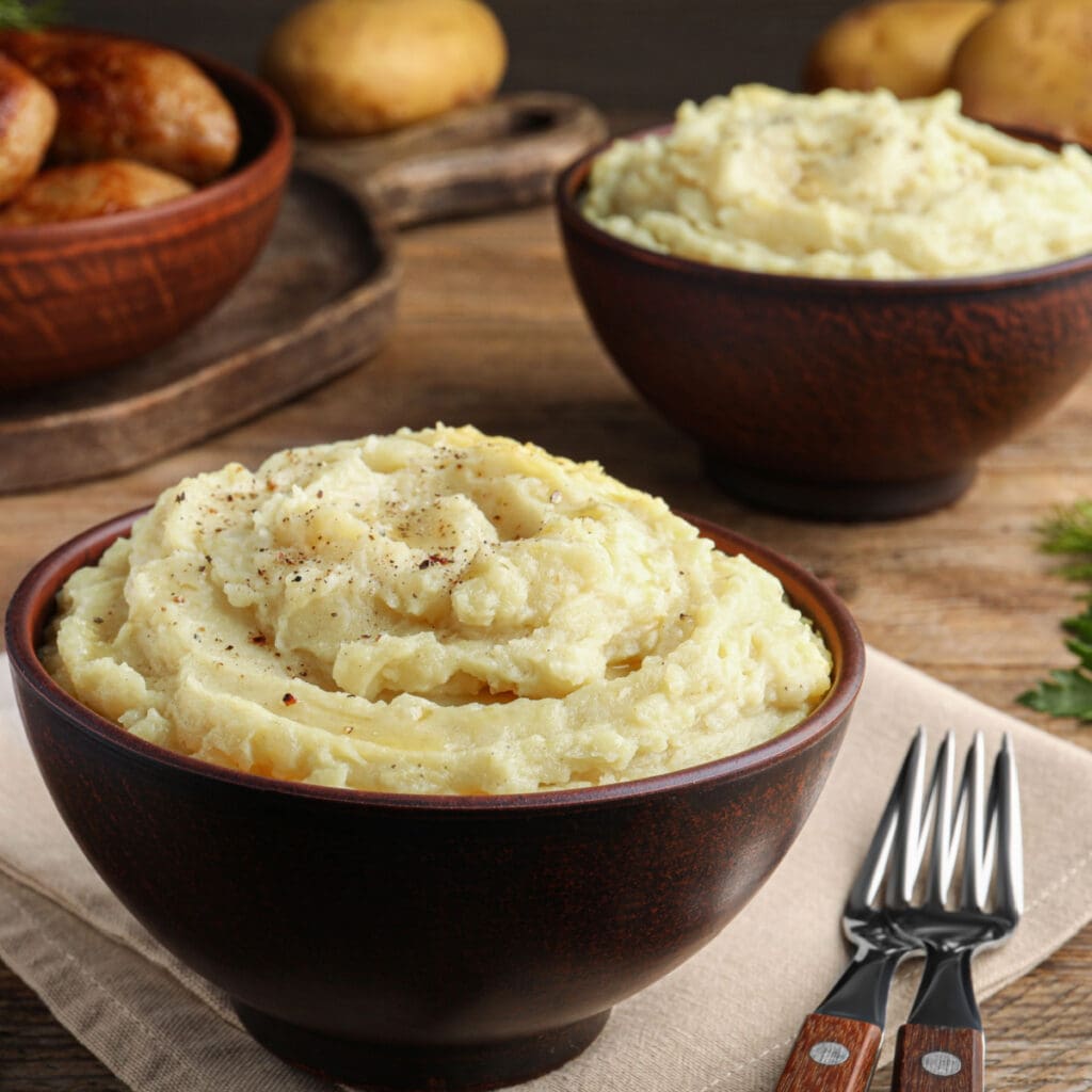 Ina Garten's Mashed Potatoes in a Brown Bowl