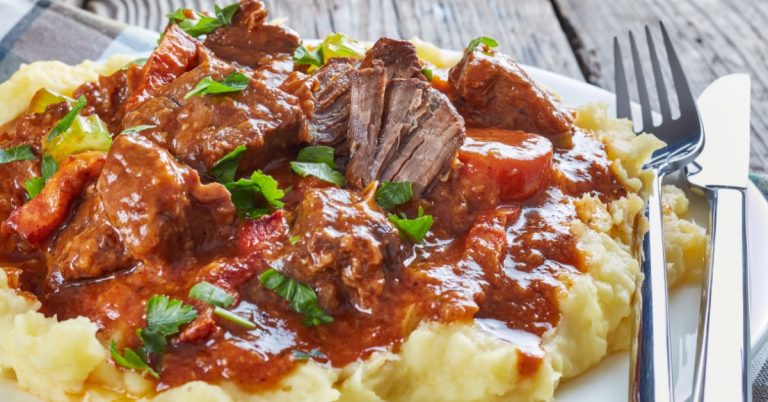 Guinness-Beef-Stew-on-Plate-Garnished-WIth-Chopped-Celery-Leaves.jpg