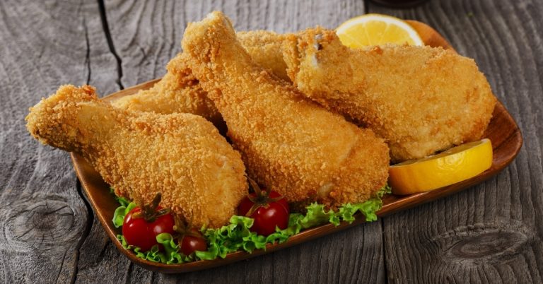 Homemade-Breaded-Fried-Chicken-Legs-with-Lemon-Tomatoes-and-Lettuce.jpg