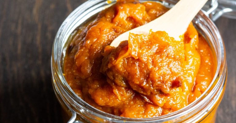 Pumpkin-Butter-on-a-Small-Glass-Jar-Scooped-With-a-Wooden-Spoon.jpg