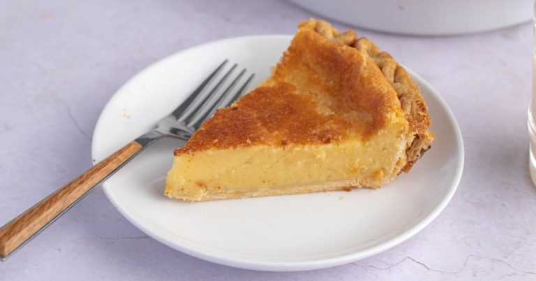 Sliced-Homemade-Silky-Eggnog-Pie-in-a-White-Plate.jpg