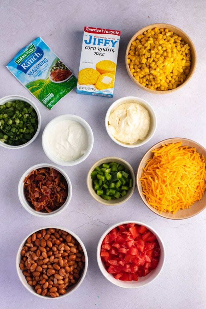 Cornbread Salad Ingredients - Dressing, Cornbread, Cheddar Cheese, Bacon Strips, and Vegetables