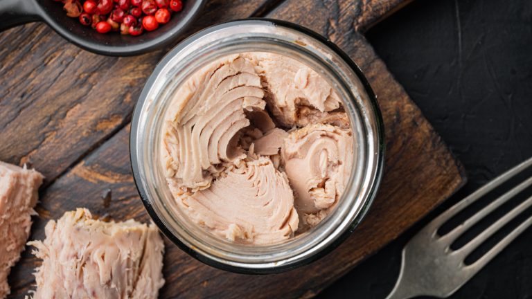 Canned,Tuna,Fillet,Meat,In,Olive,Oil,,On,Black,Background,