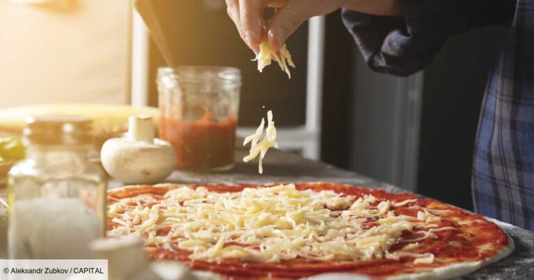 Cooking Italian Vegetarian Pizza With Vegetables And Mushrooms At Home, On A Wooden Table. The Woman Puts And Sprinkles Grated Cheese On The Dough. Step-by-step instructions, Do it Yourself. Step 4.